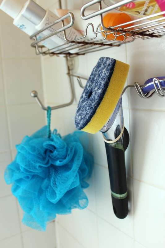 https://www.practicallyfunctional.com/wp-content/uploads/2013/04/Hang-a-brush-with-dish-soap-and-vinegar-in-the-shower-for-easy-cleaning1.png