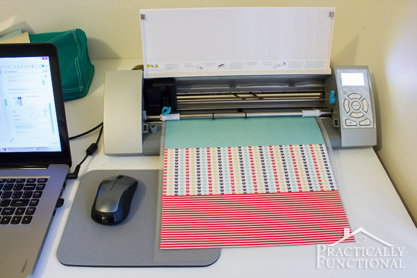 washi sheets being loaded into silhouette cameo on desktop with computer mouse and mousepad