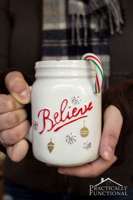 Make a cute DIY painted mug for the holidays with paint pens and adhesive stencils! Great neighbor gifts!