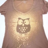 DIY bleach spray shirt with an adhesive owl stencil