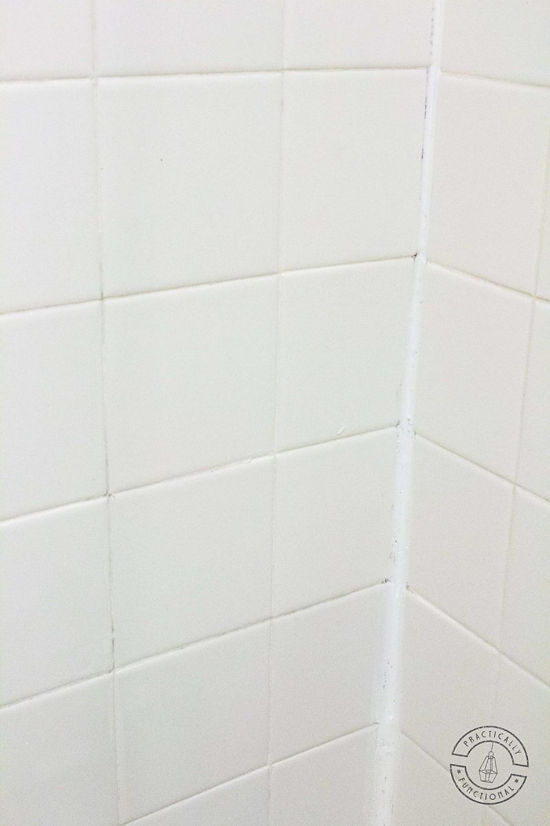 white tile wall with clean white grout and no orange hard water stains
