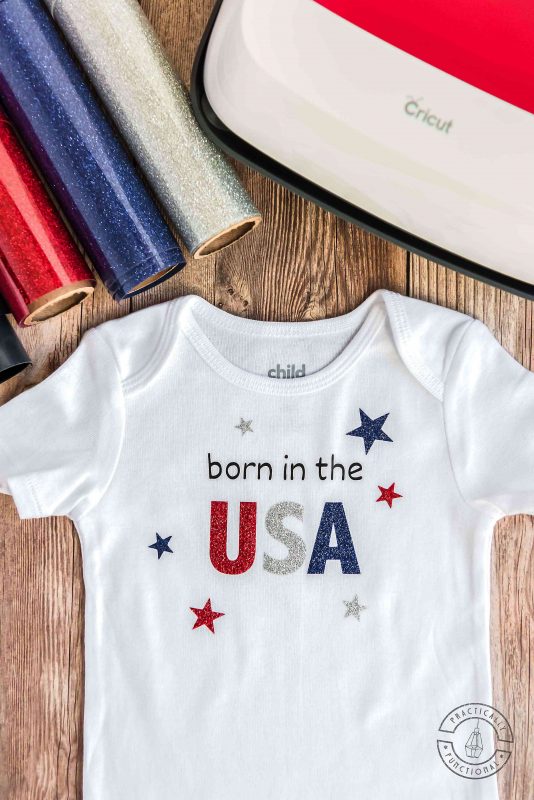born in the usa baby onesie with cricut easypress and red, white, and blue glitter heat transfer vinyl