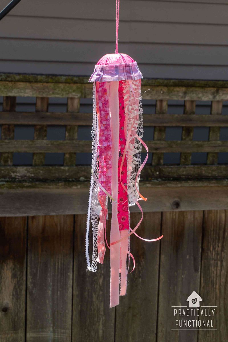 Diy jellyfish windsock made with ribbon fabric strips and a dome lid
