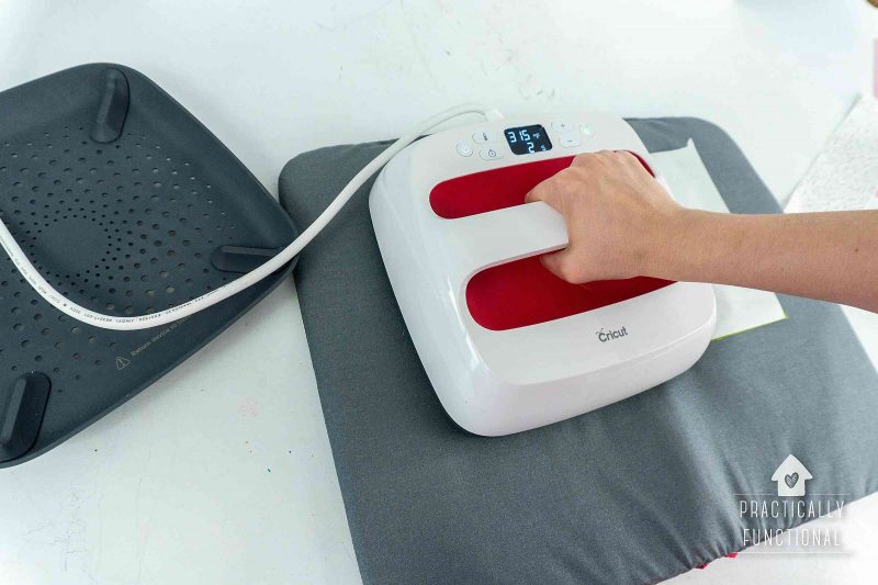 Use a cricut easypress 2 to attach heat n bond to fabric for matching christmas pajamas