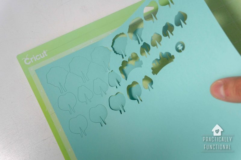 Peel background of cut paper flower pieces off of cricut mat