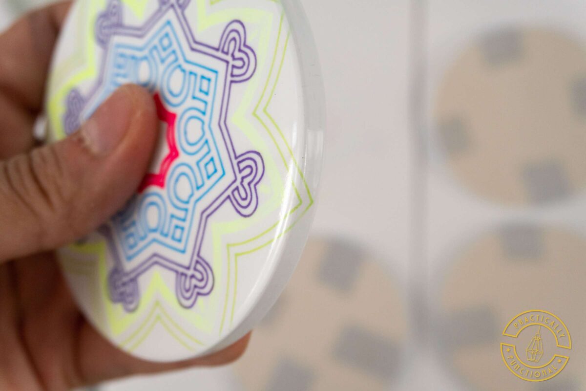 Cricut infusible ink pens and markers draw around edges on a ceramic coaster