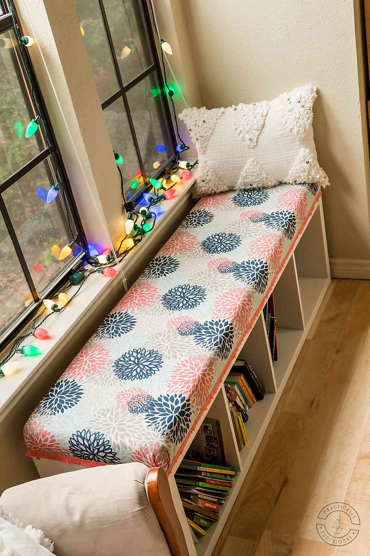 window seat made with a diy bench seat cushion on top of ikea kallax cubby storage unit